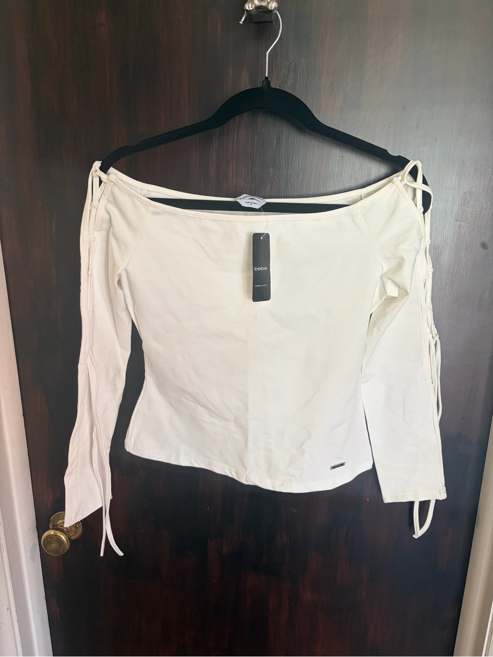 bebe Off-Shoulder Long Sleeve Top in white